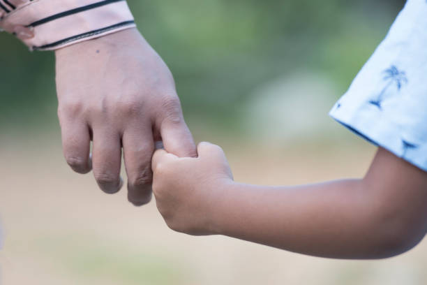 istock Mother's and a child hands 1361562174