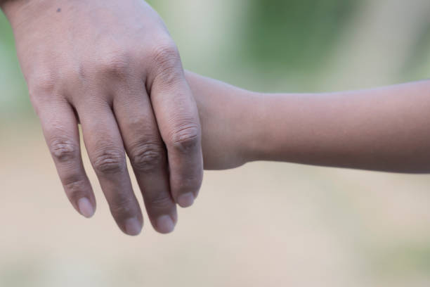 istock Mother's and a child hands 1361562202