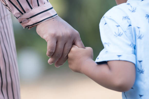 istock Mother's and a child hands 1361562210