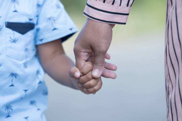 istock Mother's and a child hands 1361562234
