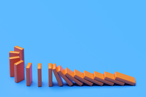 Domino.The blocks are pushing with blank background. Trends and problems concept. 3d rendering