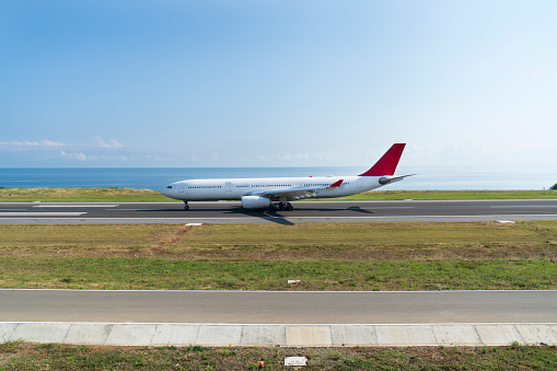 The passenger plane stopped on the runway for permission to fly