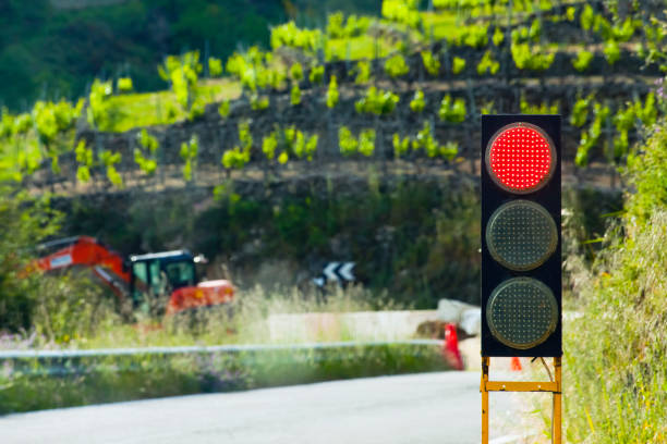 Traffic lights red arrow, single right turn sign showing a new direction, red light signal object closeup, nobody, clear sky, crossroads, traffic stopping, decision making, changing direction concept