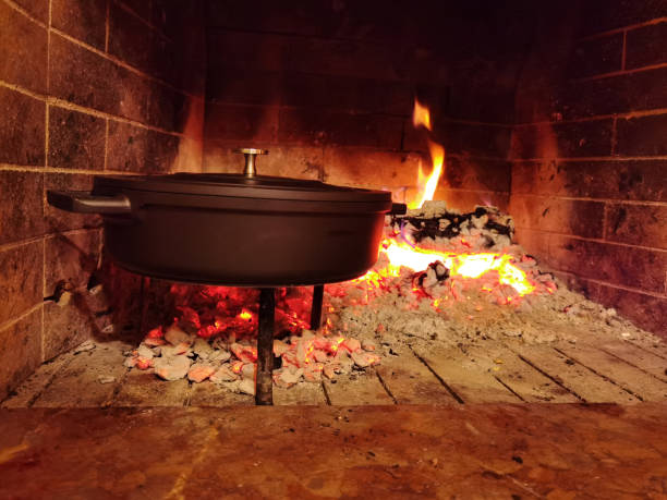 istock hull oven pan casserole in the fireplace while cooking 1361569284