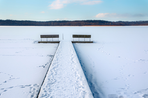 Snow-covered Finnish city park Lahti. Lake Vesijärvi. Place for winter swimming in the lake.