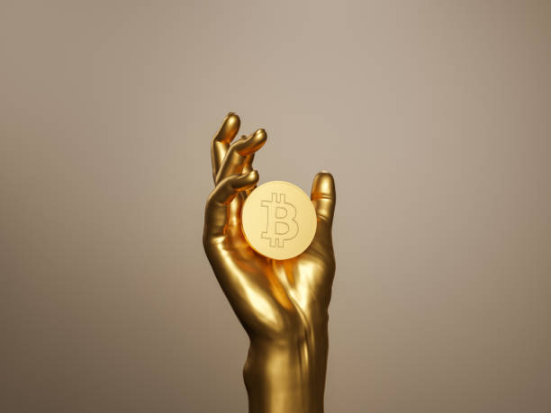 istock golden hand holding a bitcoin 1361572054