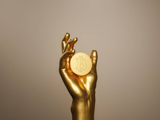 golden hand holding a bitcoin golden hand holding a bitcoin. future concept, cryptocurrencies, technology, economy and decentralization. 3d rendering gold bitcoin stock pictures, royalty-free photos & images