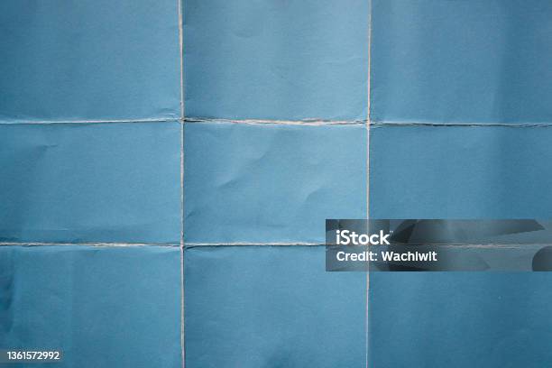 Blue Paper Folded In Nine Fraction Background Stock Photo - Download Image Now - Paper, Textured, Textured Effect