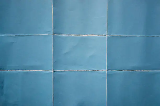 Photo of Blue paper folded in nine fraction background