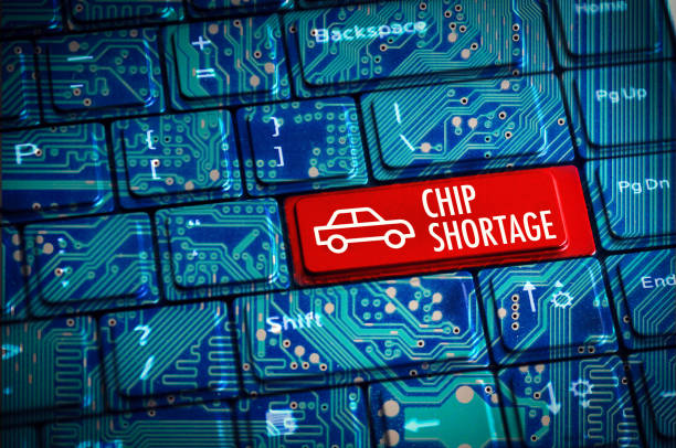 Chip Shortage or semiconductor automotive crisis concept with computer keyboard and motherboard circuits Chip Shortage or semiconductor automotive crisis concept with computer keyboard and motherboard circuits sold out photos stock pictures, royalty-free photos & images