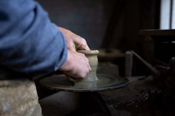 istock Cropped hands of potter making pot 1361577324