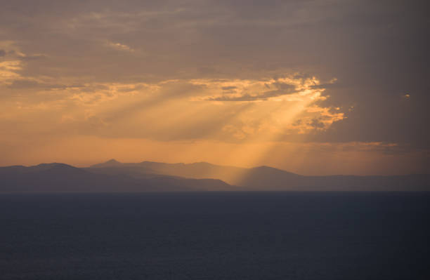 istock Angelic Sunbeam during Seascape Sunset 1361577454