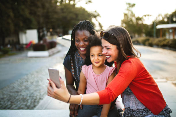 istock Taking selfies on a sunny day in city park 1361578016