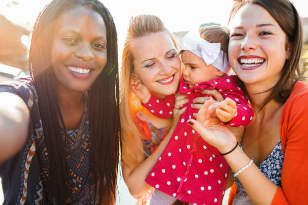 istock Taking selfies on a sunny day in city park 1361578062