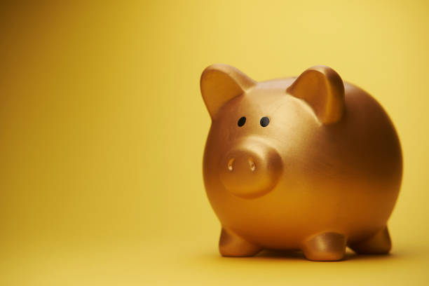 istock piggy bank on yellow background 1361579407