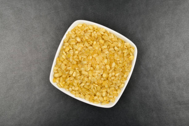 Top View of Moong Dal Namkeen on Dark Background Top View of Moong Dal Namkeen on Dark Background Moong Dal stock pictures, royalty-free photos & images