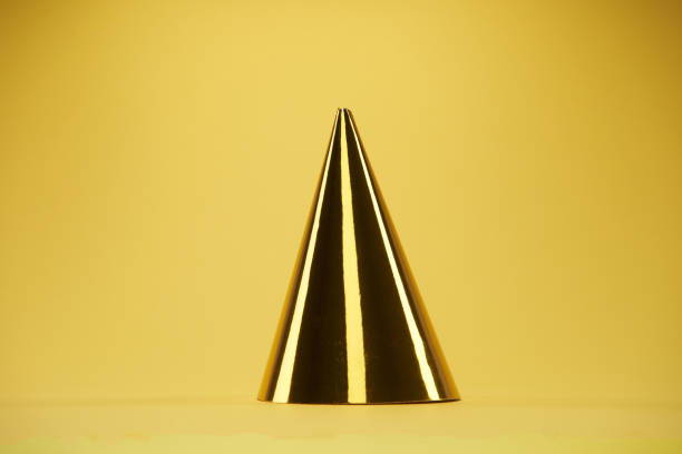 istock party hat on yellow color background 1361579746