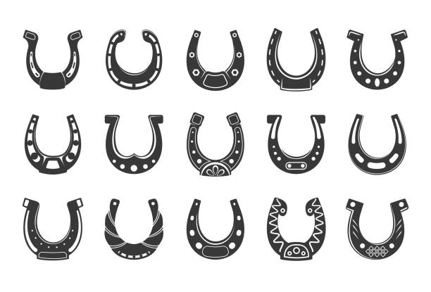 Black horseshoe. Lucky western blacksmith symbol, horse foot shoe equipment silhouette. Fortune talisman or amulet with decorative ornaments, icons collection. Vector isolated set Black horseshoe. Lucky western blacksmith symbol, horse foot shoe equipment silhouette. Fortune talisman or amulet with decorative ornaments, icons collection. Vector isolated on white background set horseshoe horse luck good luck charm stock illustrations