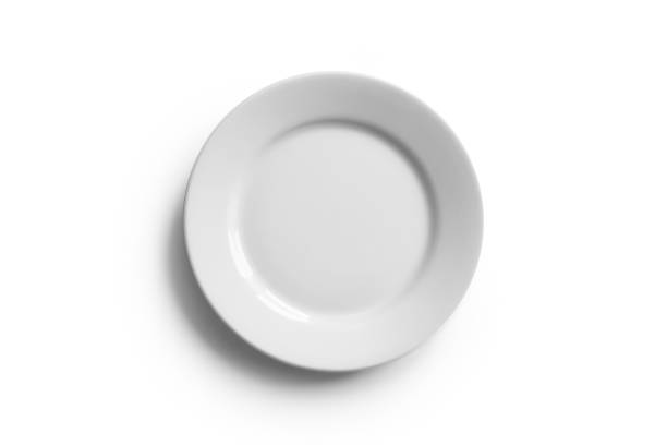 istock White plate with shadow on white background with clipping path. Top view. 1361582478