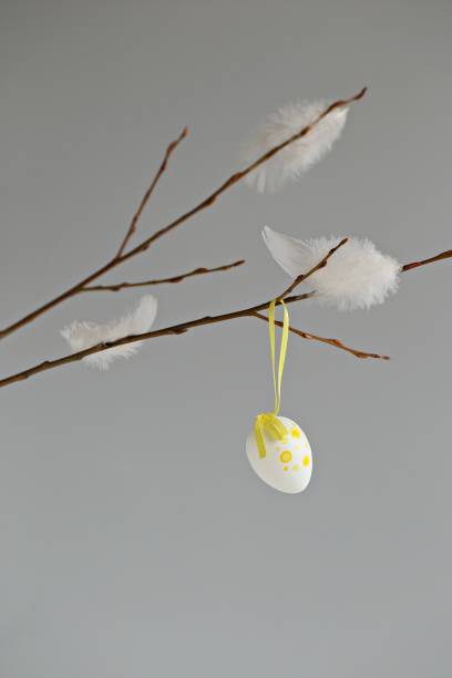 istock Easter festive home decoration with willow branch , easter egg and feathers. 1361583975
