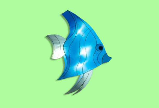 istock fish lamp puppet isolated on green background 1361584876
