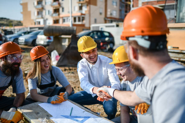 istock Architect Meeting Civil Engineers And Construction Workers On Site While Discussing Blueprints 1361588153