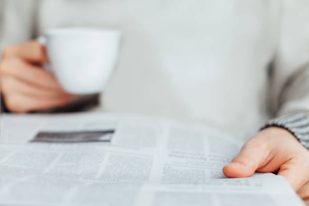istock Close Up Of Man Reading Newspapers 1361588828