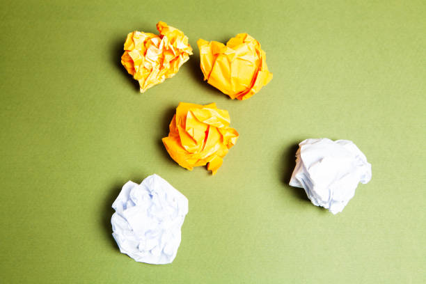 istock wads of papers on a green background 1361589013
