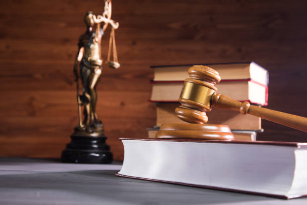 istock statue of justice, book and gavel 1361590428