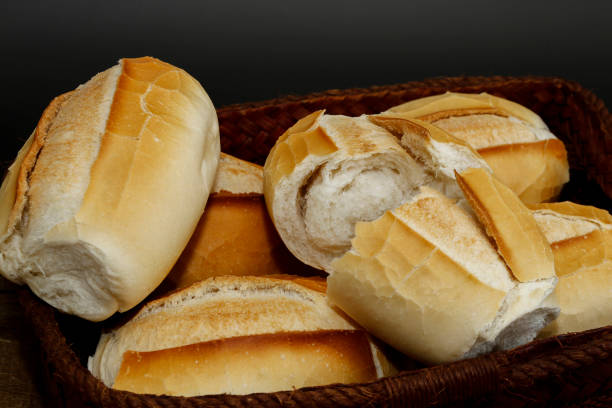 istock Portion of french bread on black background 1361590623