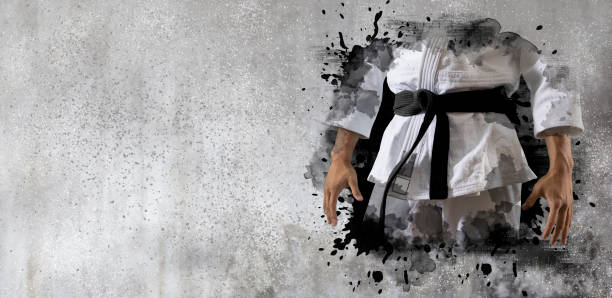 壁の背景に武道のマスター - karate judo belt aikido ストックフォトと画像