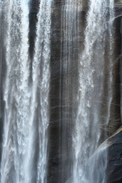istock Waterfall Detail with Granite Cliff 1361596216