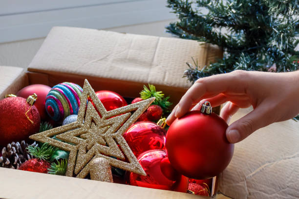 istock Christmas decorations in carton box 1361598482