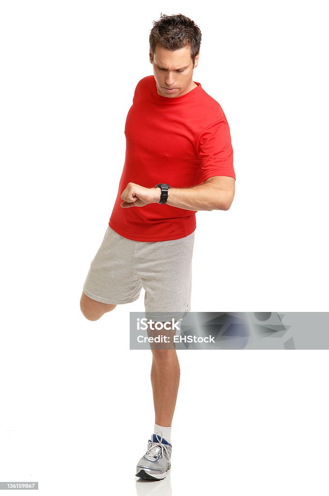 Человек, физические упражнения, растяжения, Проверка частоты пульса на часы - Стоковые фото Бегать трусцой роялти-фри
