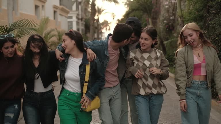Navigating the Complexities of Adolescence 2 a group of people walking on a sidewalk