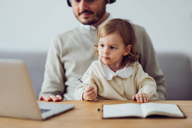 istock An Anonymous Father Talking on Video Call Meeting at Home 1361604475