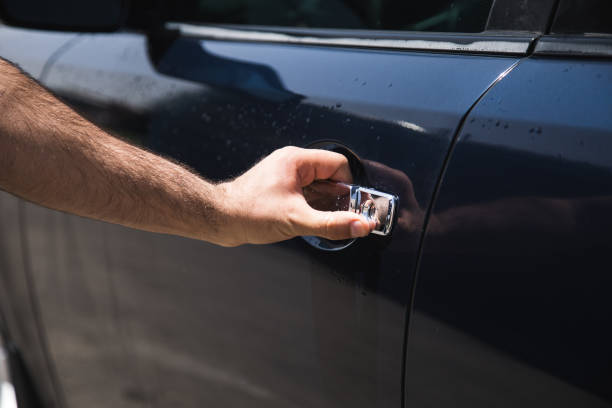 istock a man opens a car door 1361606631