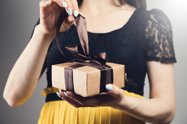istock Young girl with gift box 1361609848
