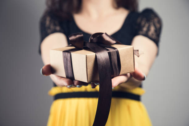 istock Young girl with gift box 1361609853