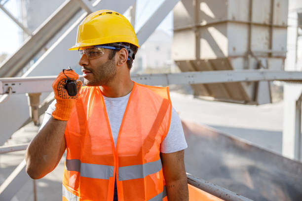 istock Young building industry worker working hard outdoors 1361611151