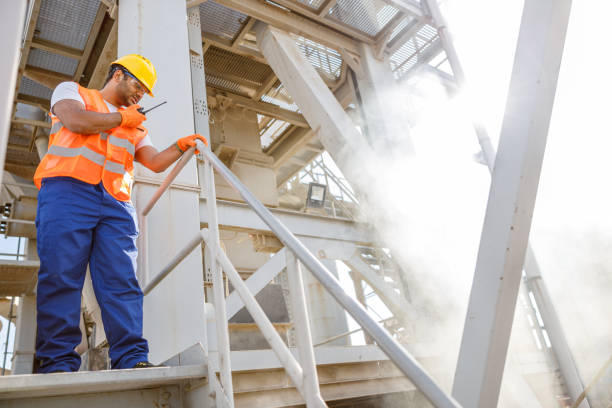 istock Experienced worker concentrating at his work in plant 1361611155