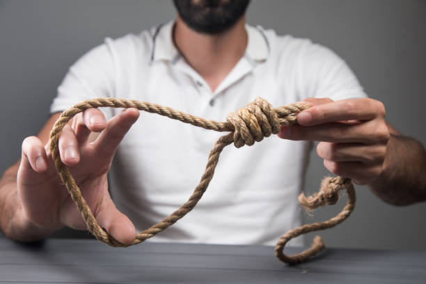 istock man holding a noose. suicide concept 1361611254