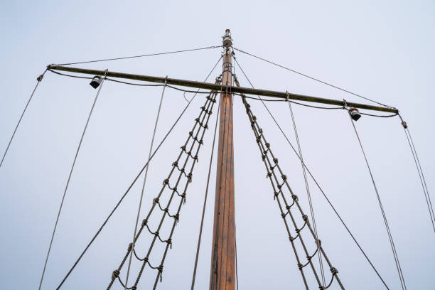 ropes and rope ladder on a sailing ship with cloudy sky - sailing ship nautical vessel rigging industrial ship imagens e fotografias de stock