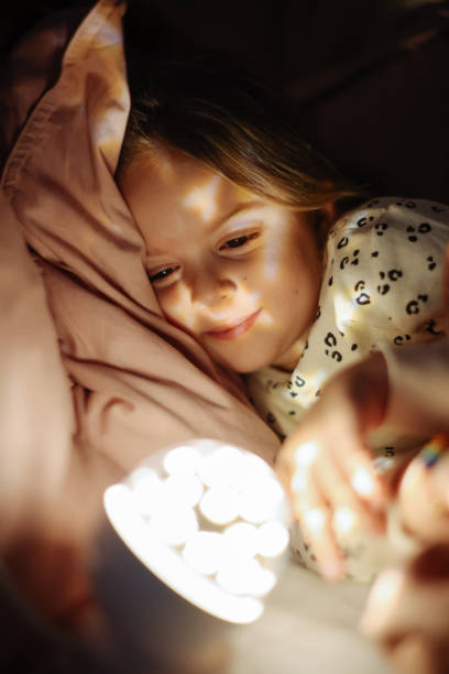 istock Little preschool girl sleeping in comfortable bed 1361612612