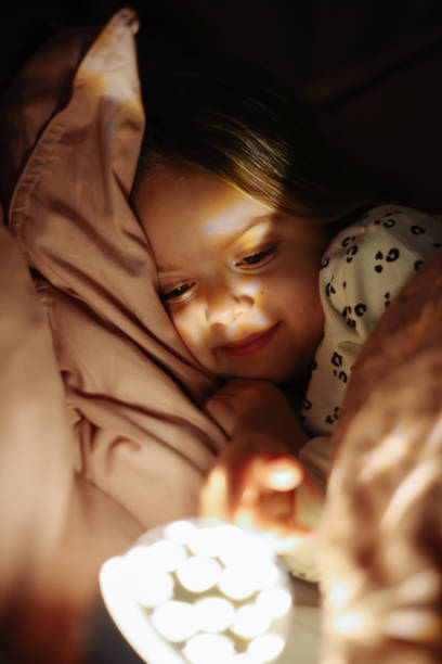 istock Little preschool girl sleeping in comfortable bed 1361613147