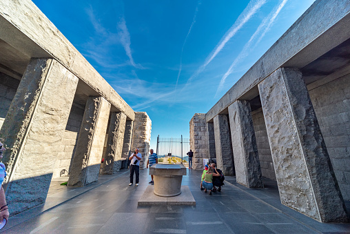 Lovcen,Montenegro-September 14 2019: On the summit of Mount Lovcen,visitors admire the columns and marbled floor outside, before entering the decorative chamber housing the memorial to Njegos.
