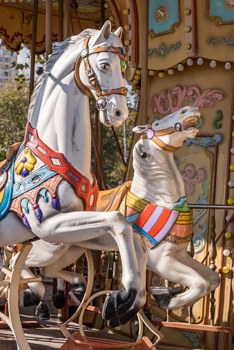 Jerusalem, Israel November 23, 2021 Colorful carousel with horse figures, merry go round at the old train station in Jerusalem, Israel