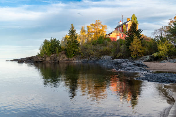 istock Marquette Harbor Lighthouse at sunset in the fall along Lake Superior 1361614551