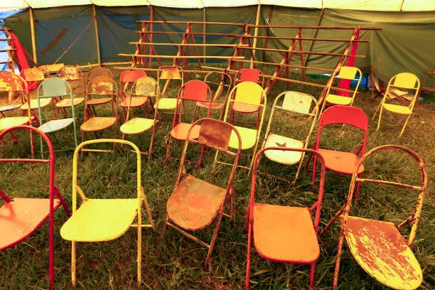 Photo of Audience of traveling circus with empty chairs