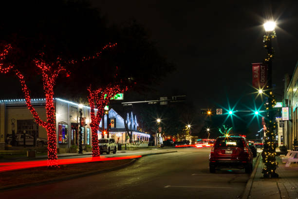 Main Street in Frisco, Texas, USA Frisco, Texas, USA - December 17th, 2021: Main street illuminated at night frisco texas stock pictures, royalty-free photos & images